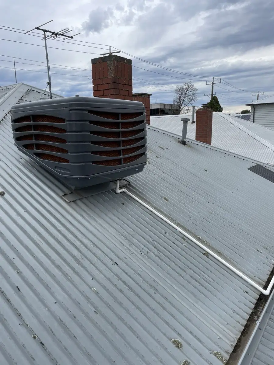 Evaporative cooler unit installed on a Melbourne home roof