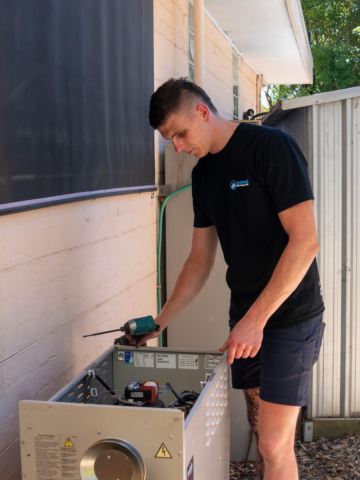 OnePeak technician repairing HVAC system